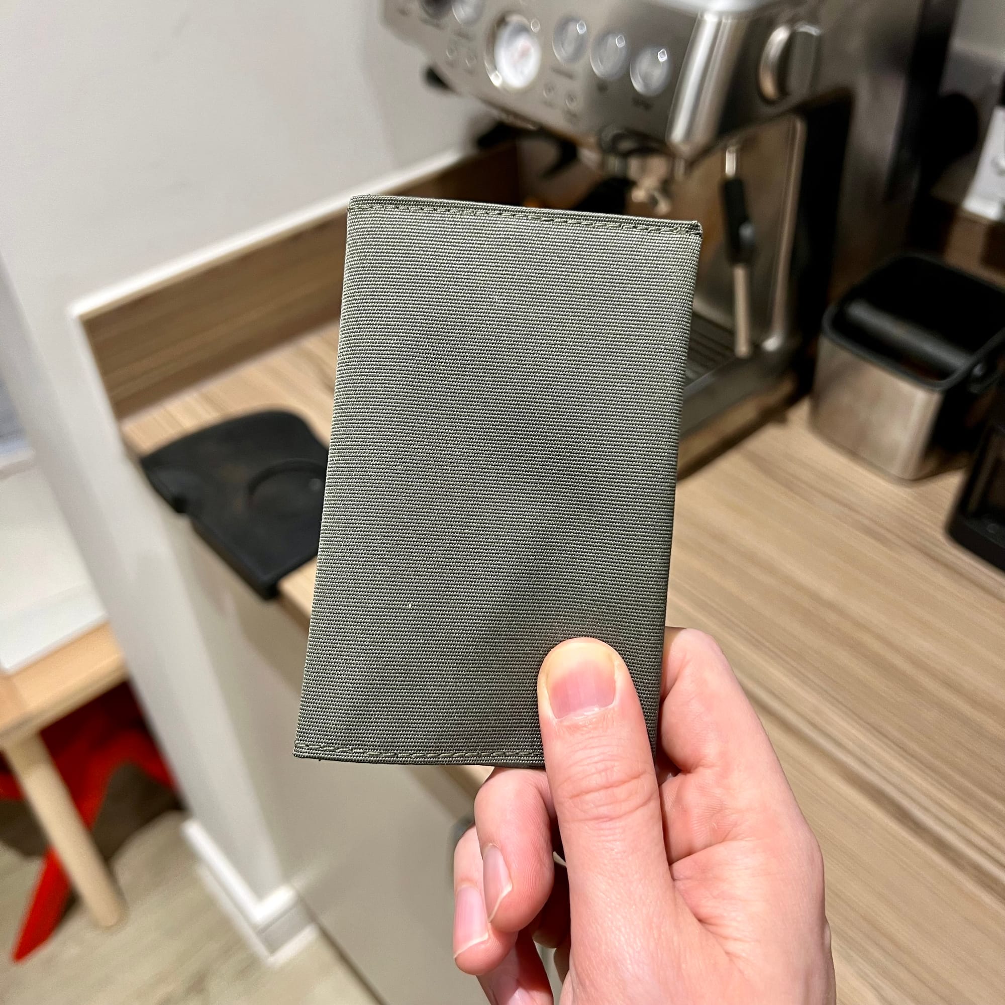 A green sleeve about the size of a wallet